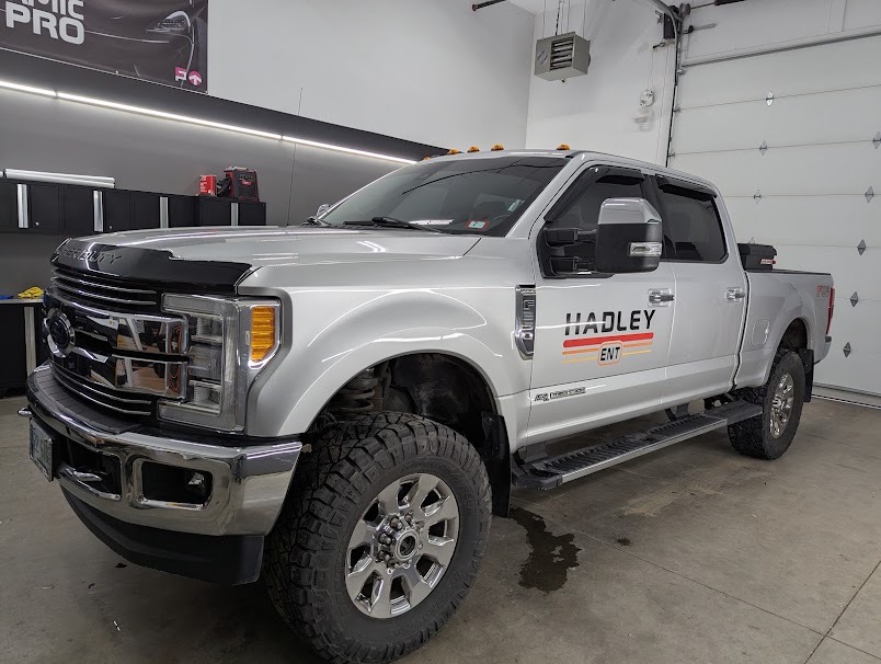 Contractor's Ford F-250 in the bay after a fleet-style window film install.